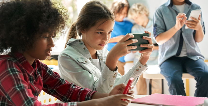 Featured image showing elementary students using cellphones in the classroom.